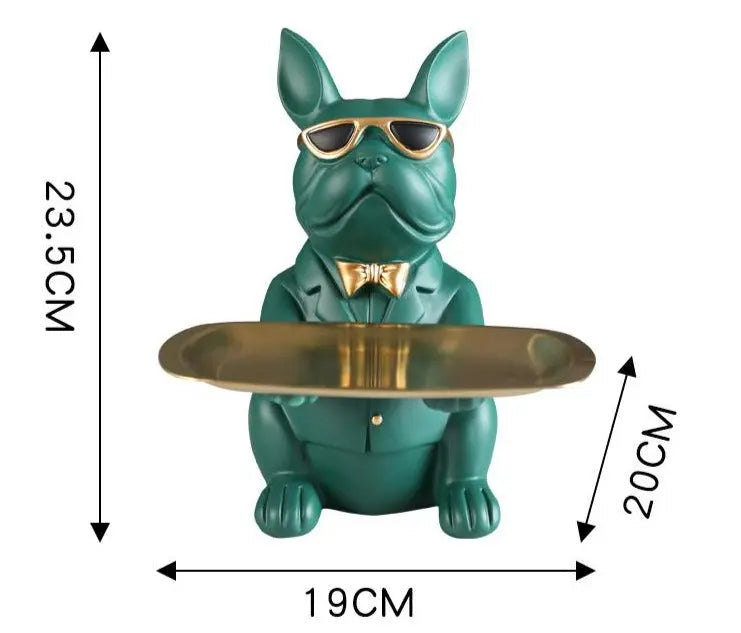 Green dog-shaped holder with a gold tray, sunglasses, and a bow tie, with dimensions indicated.