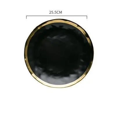 Black round dish with gold rim and measurement label on a white background