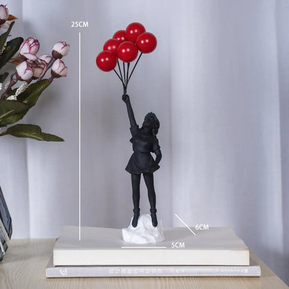 Statue of a girl holding red balloons with measurements on a white surface.