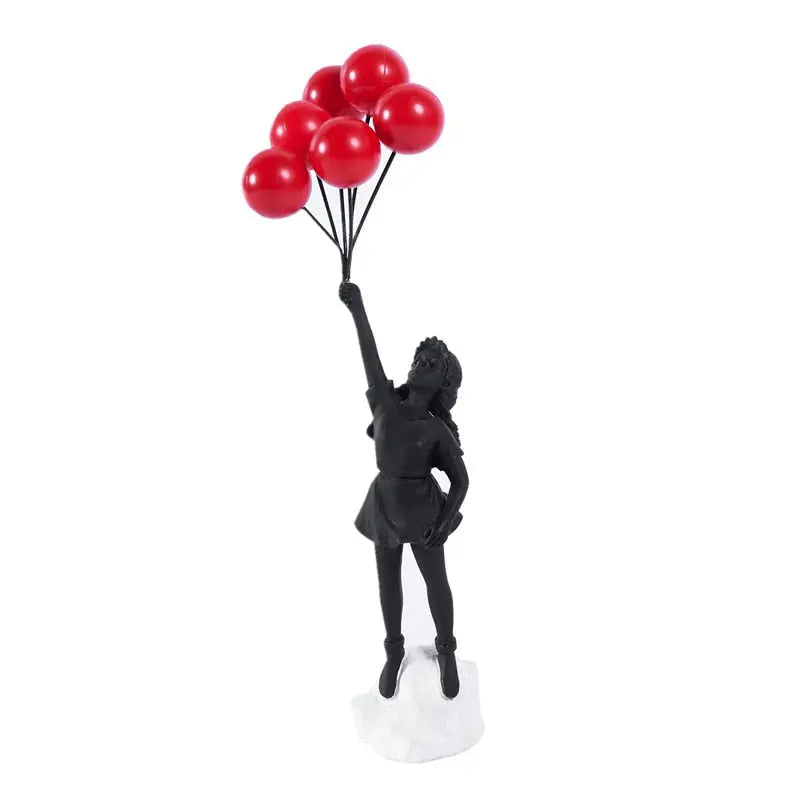 Black figurine holding red balloons on a white background