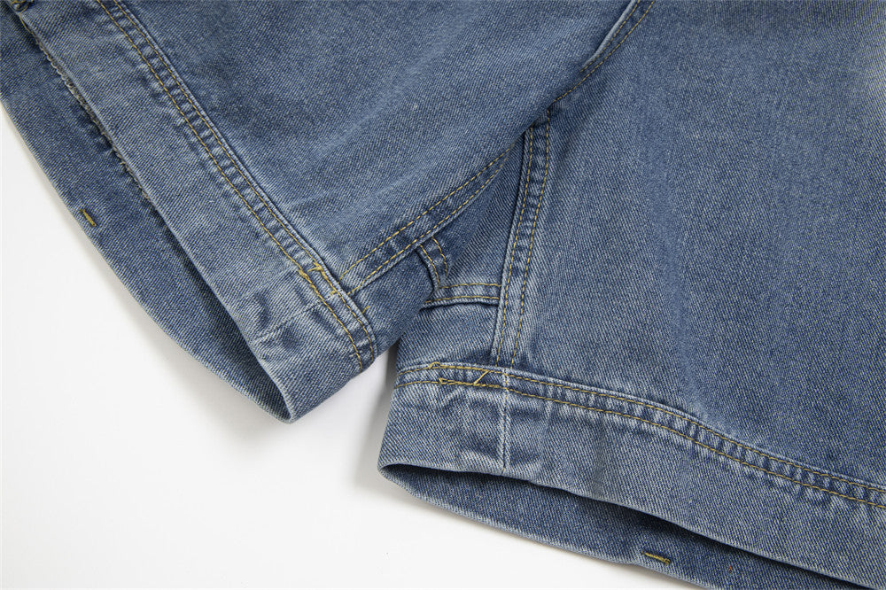 Close-up of blue denim fabric on a white background