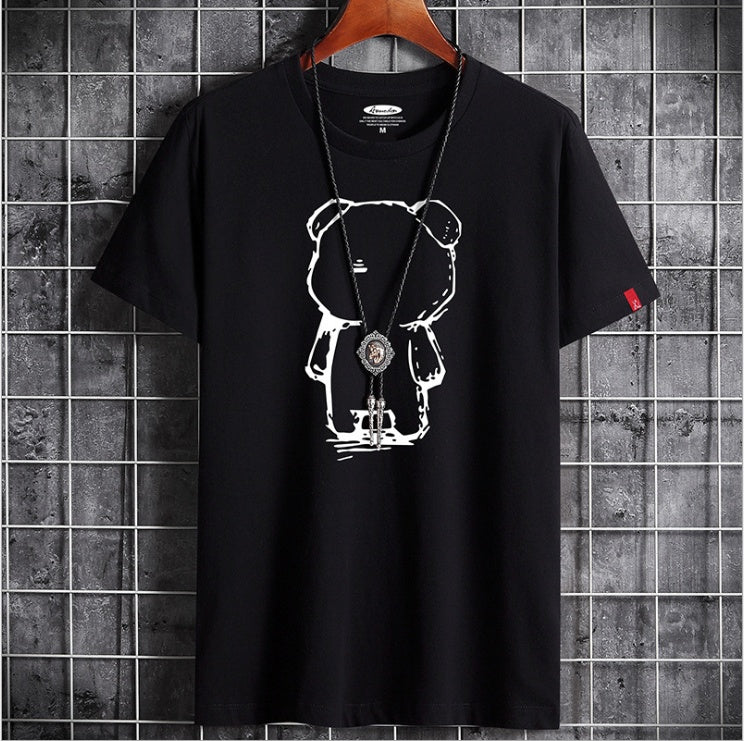 Black t-shirt with white graphic design on a hanger against a tiled wall background
