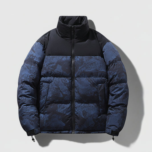 Blue and black puffer jacket on a white background