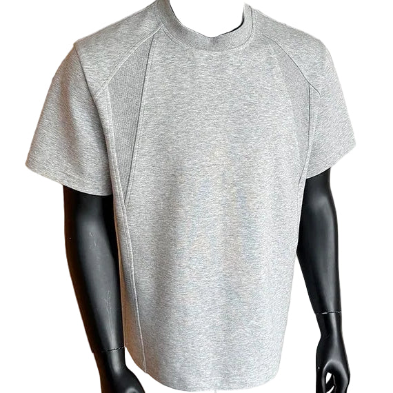 Gray athletic shirt on a mannequin against a neutral background