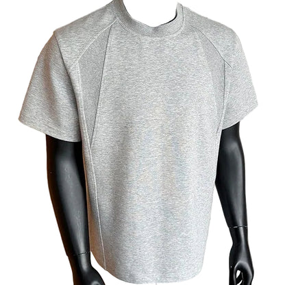 Gray athletic shirt on a mannequin against a neutral background