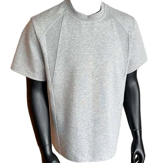 Gray athletic shirt on a mannequin against a neutral background