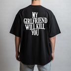 Black t-shirt with white text 'MY GIRLFRIEND WILL KILL YOU' on the back, worn by a person against a plain background.