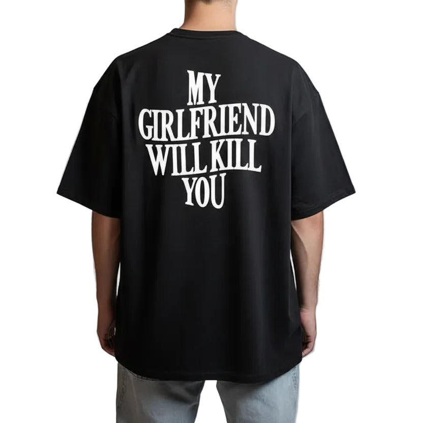 Black t-shirt with white text 'MY GIRLFRIEND WILL KILL YOU' on the back, worn by a person against a plain background.