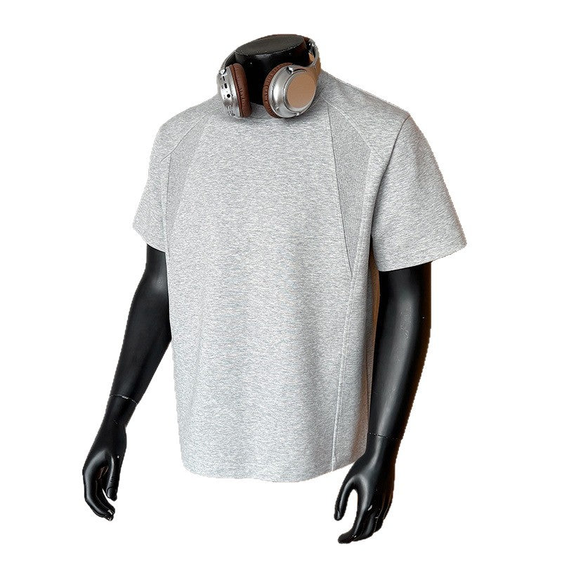 Gray t-shirt on a mannequin with headphones on a white background