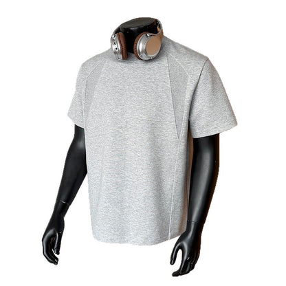 Gray t-shirt on a mannequin with headphones on a white background