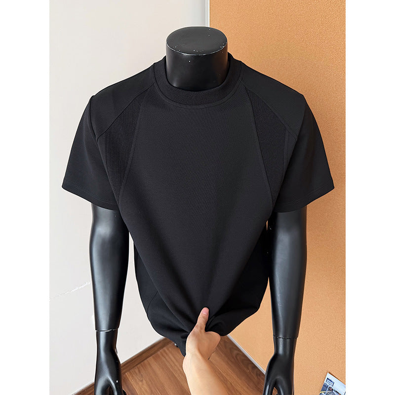Black turtleneck shirt on a mannequin against a plain background