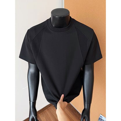 Black turtleneck shirt on a mannequin against a plain background