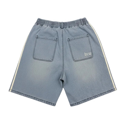 Blue denim shorts with white stripes on a white background