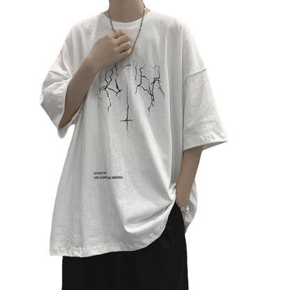 Person wearing a white t-shirt with black graphics on a white background