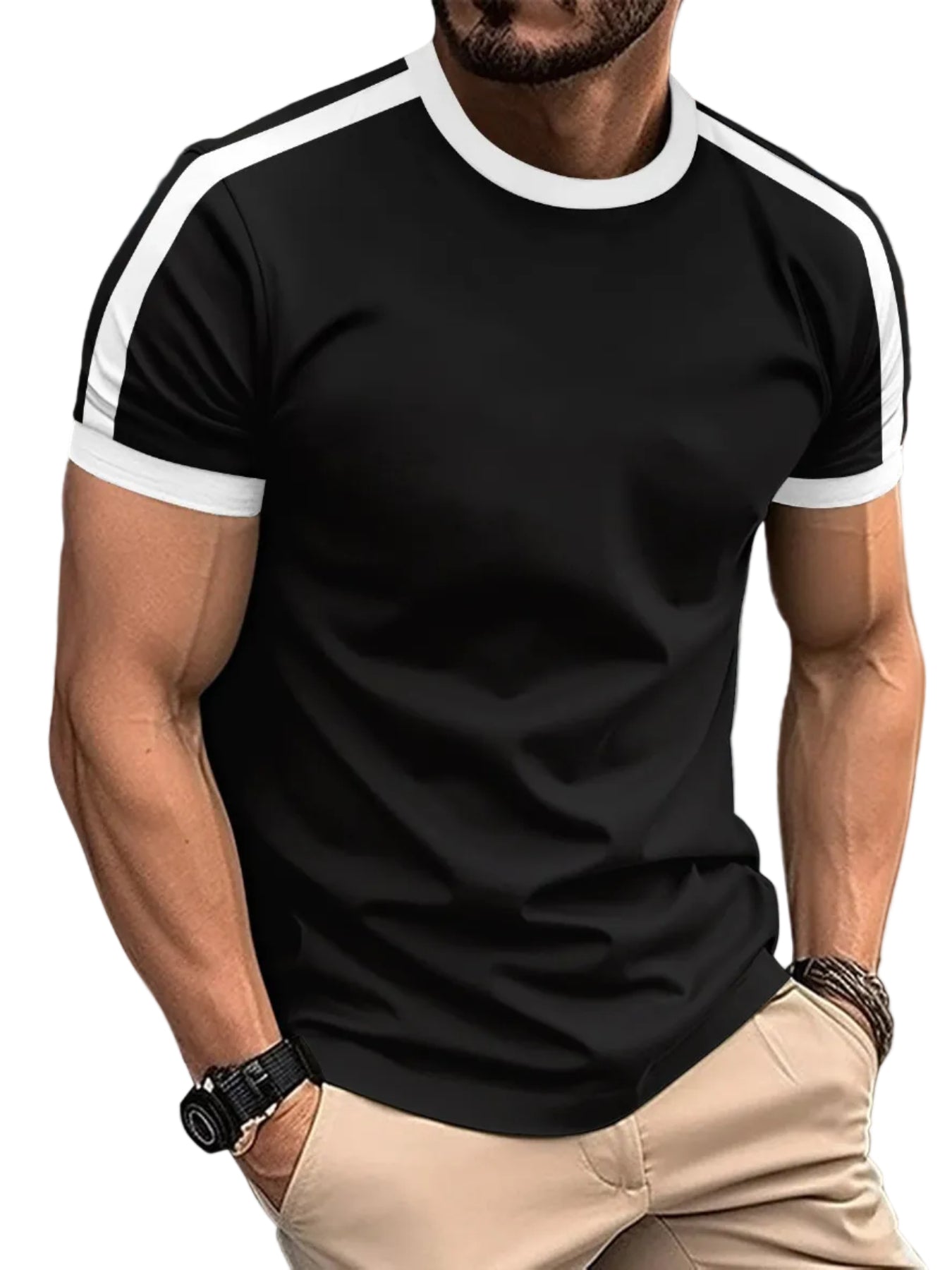 Man wearing a black t-shirt with white trim on a city street