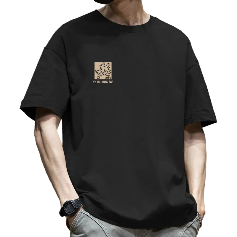 Person wearing a black t-shirt with a logo and text on a brown background