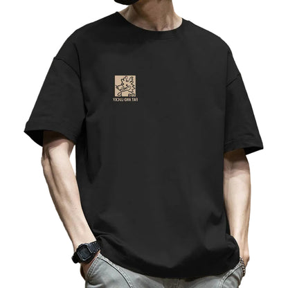 Person wearing a black t-shirt with a logo and text on a brown background