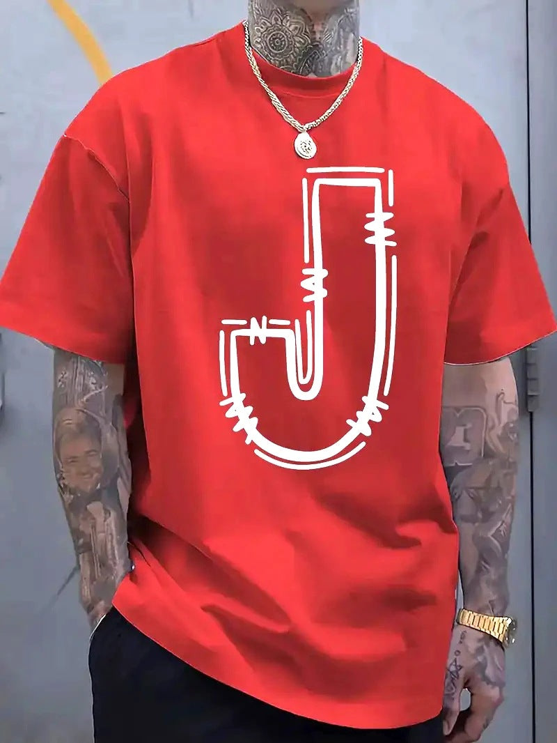 Person wearing a red t-shirt with a white logo, standing against a gray wall.