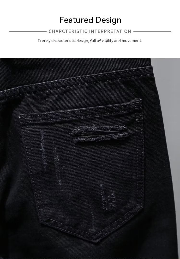 Black denim pocket with distressed details on a dark background