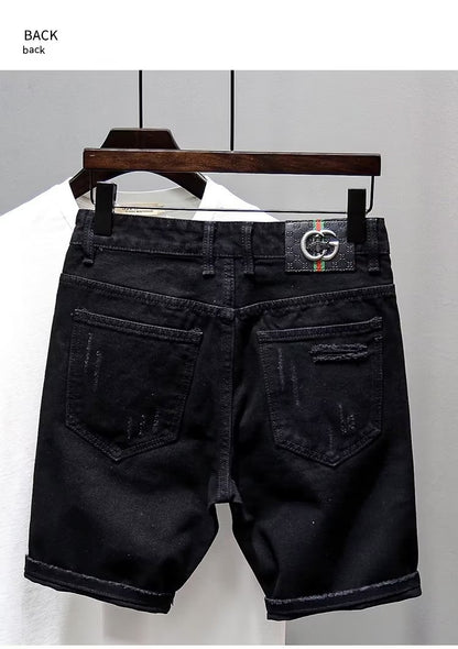 Black denim shorts on a hanger against a white background