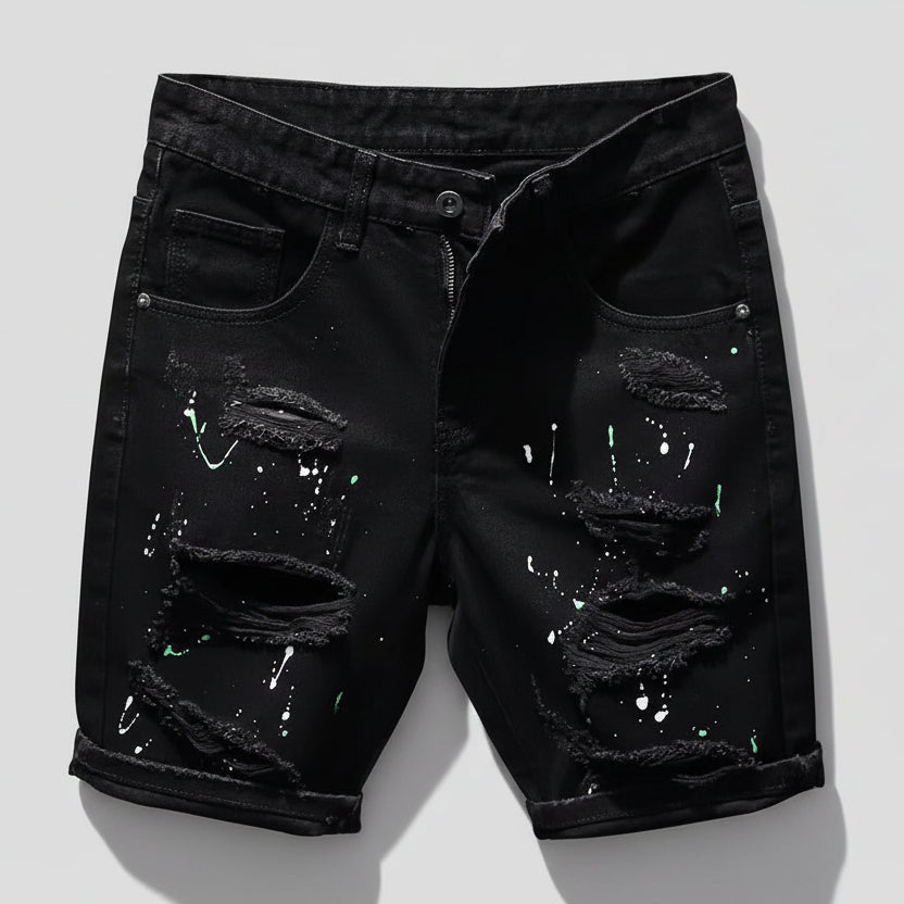 Black distressed denim shorts on a white background