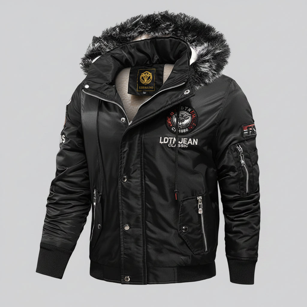 Black winter jacket with fur-lined hood on a dark background