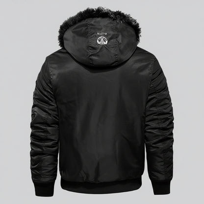 Black winter jacket with fur-lined hood and flame graphic on a dark background