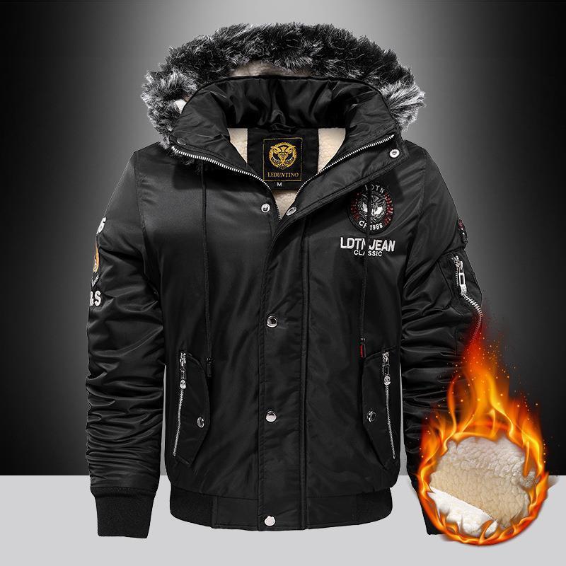 Black winter jacket with fur-lined hood on a dark background