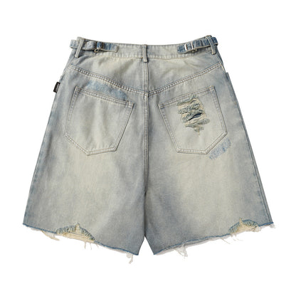 Light blue denim shorts with distressed details on a white background