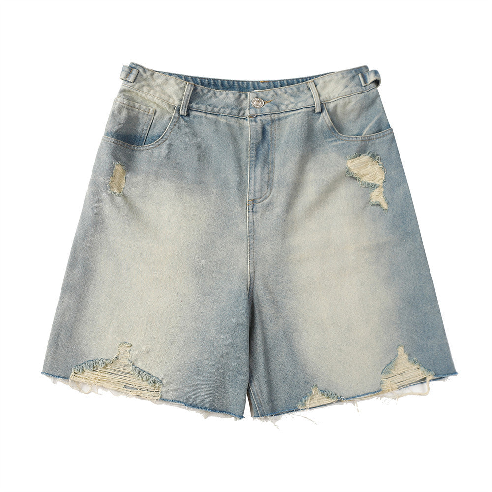 Distressed denim shorts on a white background